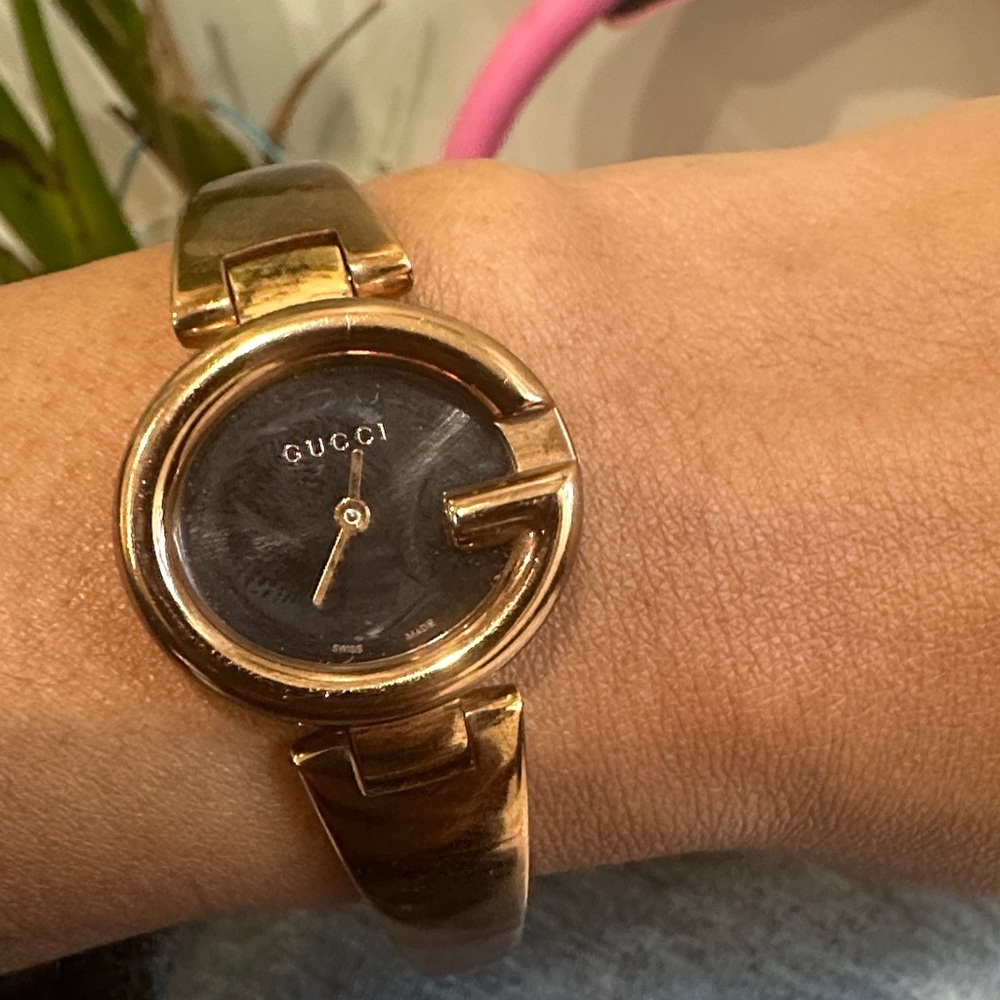 Gucci Women's Gold and Black Watch